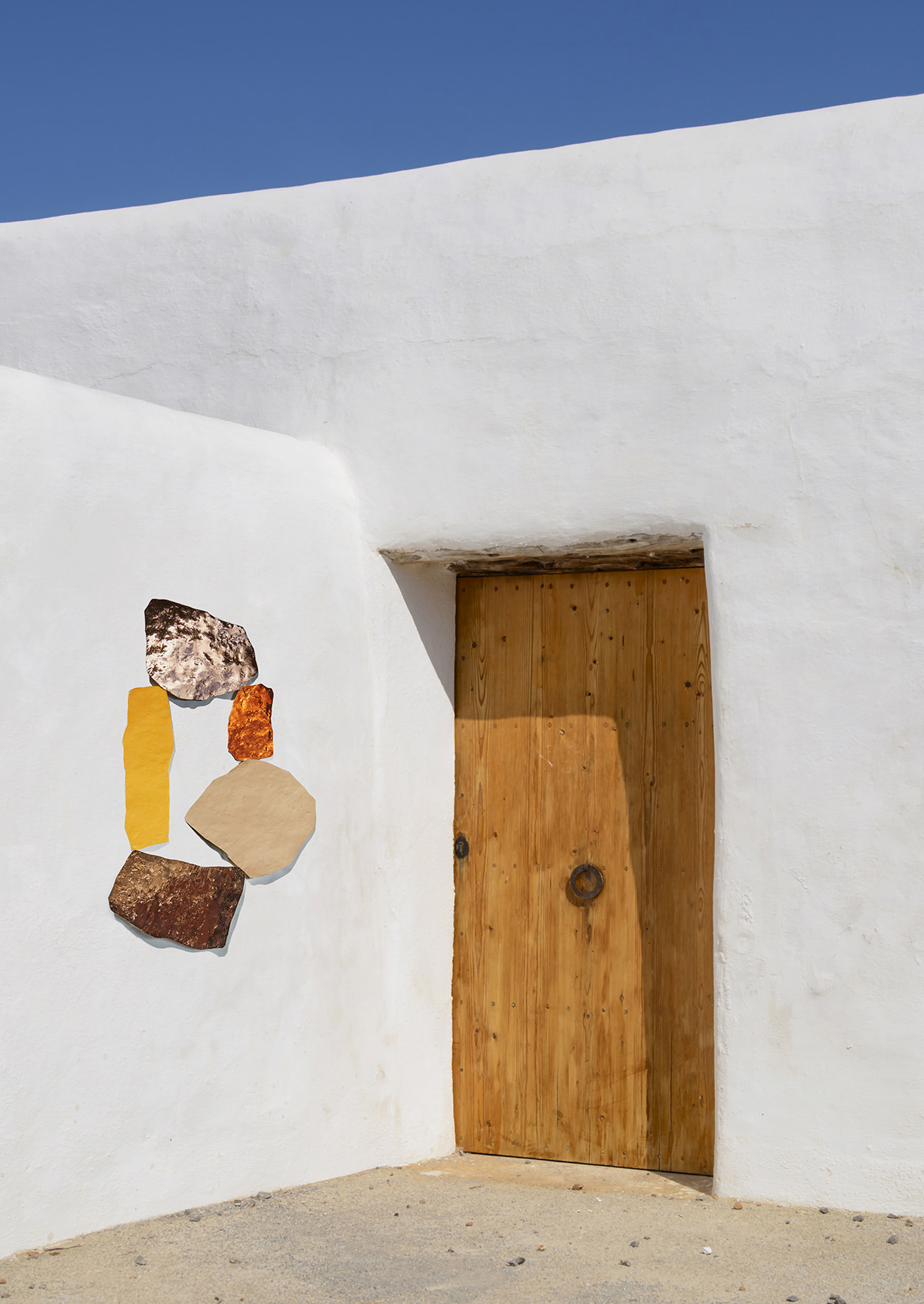 Ibiza typical rural home , made ​​with stone and lueco with a layer of lime. The wooden door with wooden Sabina contruia