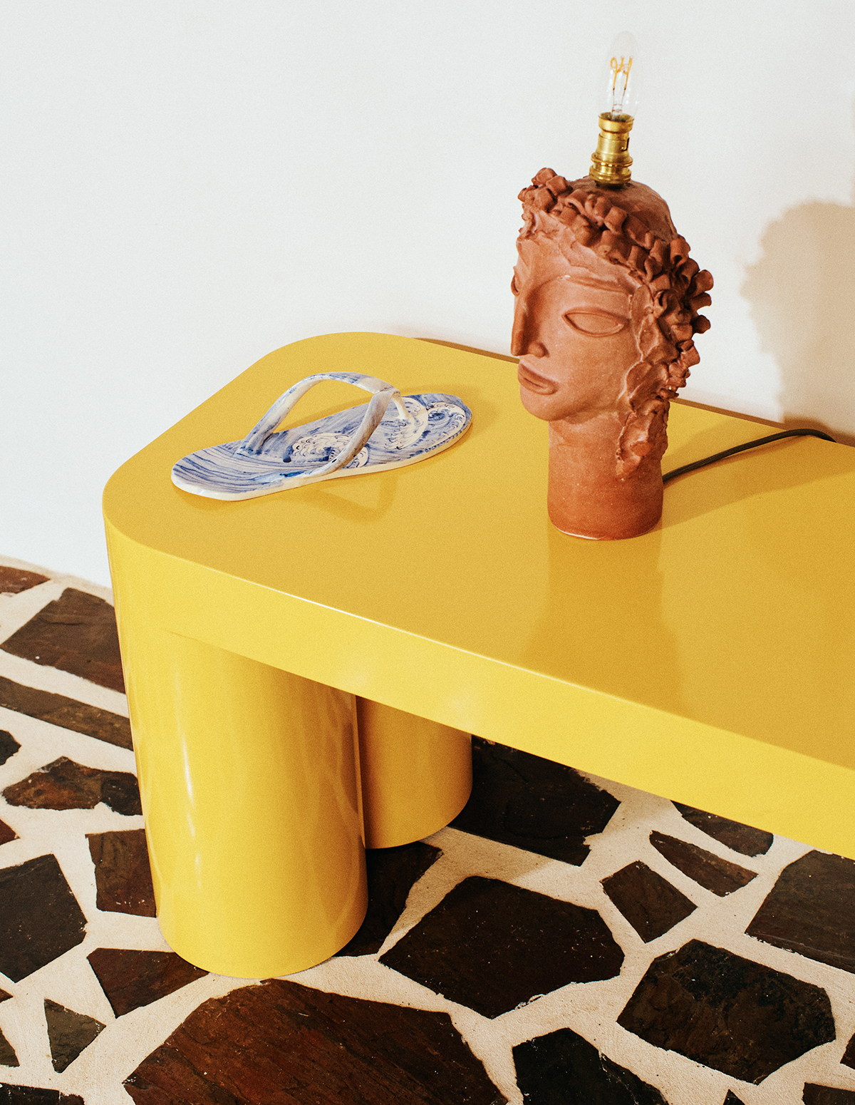 Reception at The Sunseeker, Byron Bay; yellow HUG bench seat by Jack Fearon; Anna Karinae lamp; Gerry Wedd ceramic thong (photo credit. James Tolic)